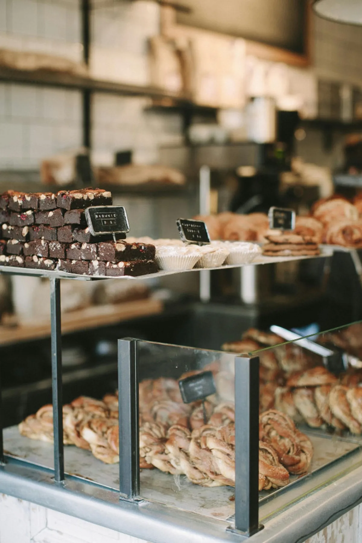 A tempting spread of brownies, croissants, and cinnamon rolls arranged on a counter, suggesting the warmth of local bakeries and the pleasure of enjoying fresh treats while exploring downtown.